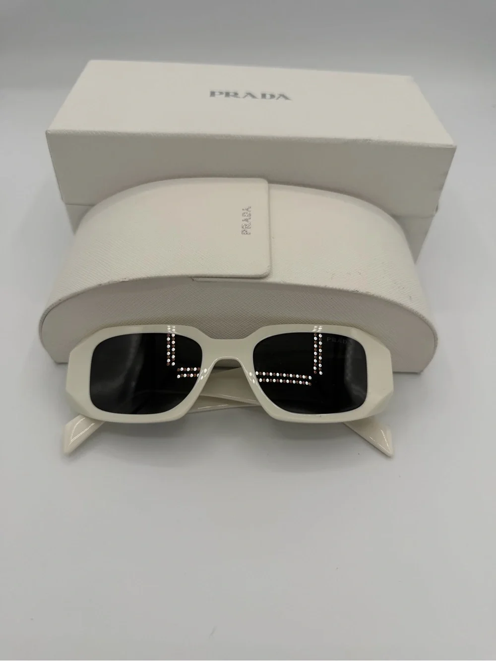 Prada White Glossy Frame Sunglasses with Dark Lenses